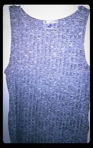 Sleeveless tank top with slits in the side.